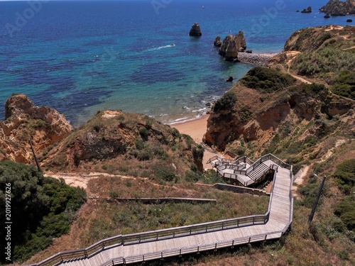 Canvastavla Aerial drone view of Praia Dona Ana beach and cliffs in Lagos Algarve Portugal