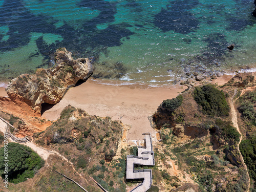 Fotografie Aerial drone view of Praia Dona Ana beach and cliffs in Lagos Algarve Portugal