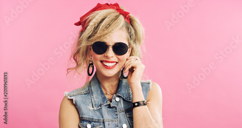 Photos Fashion, retro and woman in studio with sunglasses, pop clothing or classic outfit in 80s aesthetic