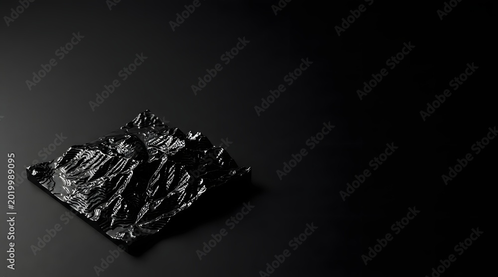 Naklejka premium A shiny black object sits on a dark surface with a rugged texture visible.
