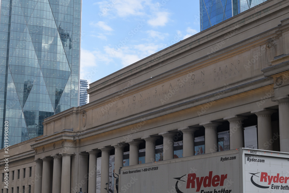 Naklejka premium Ryder delivery truck outside Union Station with view of CIBC Square; looking east, south side, Front St W, Toronto
