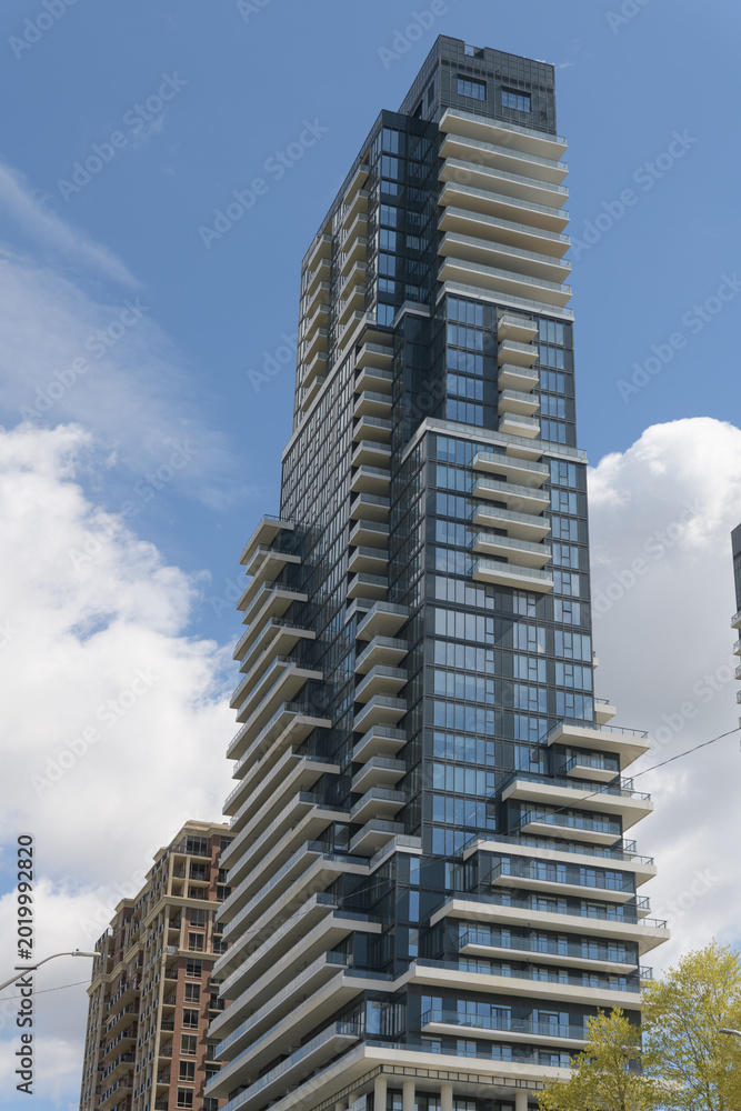 Fototapeta premium south elevation of Chateau Auberge on the Park, a luxury 39-storey condominium by Tridel located at 10 Inn on the Park Dr, Toronto