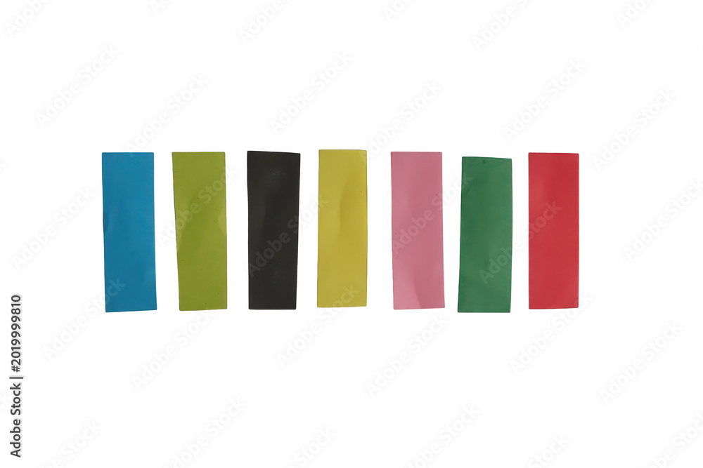 Fototapeta premium A vibrant assortment of seven rectangular strips of colored paper arranged in a neat horizontal row against background.