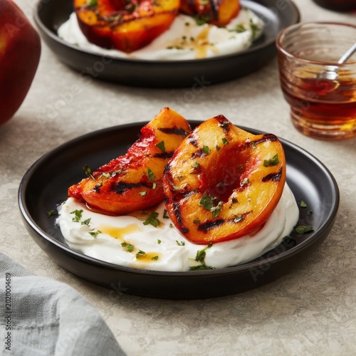 Grilled Peaches Served on Yogurt With Honey and Fresh Herbs on a Table