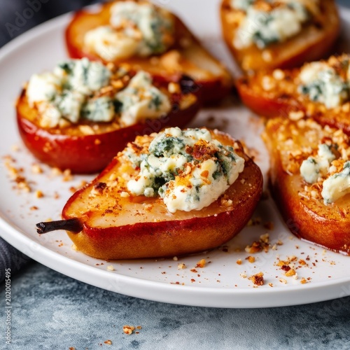 Grilled Apples Topped With Cheese and Nuts Served on a White Platter With Hon...