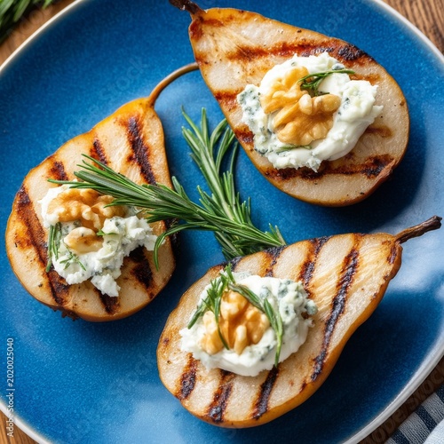 Grilled Pears With Cheese and Nuts on a Blue Plate in a Kitchen Setting