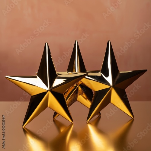 Three Gold Stars Placed on a Reflective Surface With a Soft Background