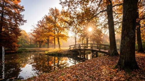 Wooden arch bridge over peaceful pond surrounded by colorful autumn foliage and.