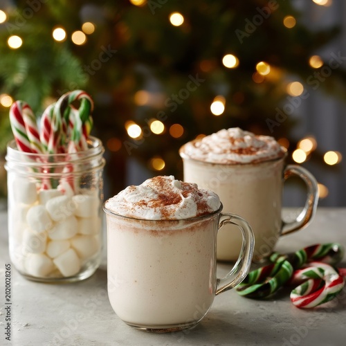 Warm Drinks With Whipped Cream and Candy Canes on a Table Near a Decorated Tr...
