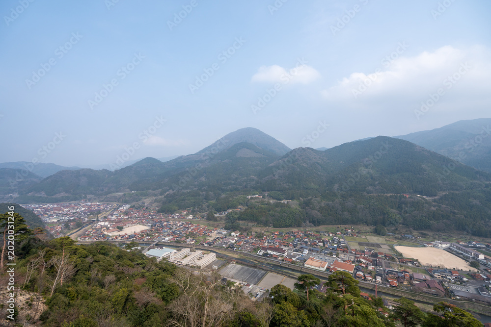 Fototapeta premium Hazy Panoramic View of Tsuwano Town and Valley from Tsuwano Castle Ruins, Shimane
