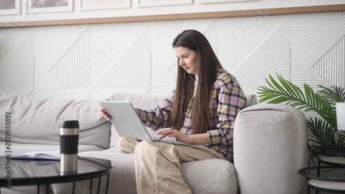 Working from home in a cozy office corner with a laptop and a cup of coffee