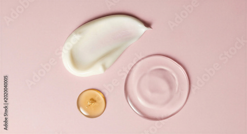 Comparison of cream and gel textures on pink surface.