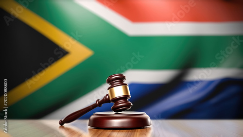 Judge gavel before blurred South African national flag