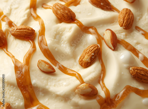 Creamy vanilla yogurt or ice cream texture with caramel swirl ribbons and scattered whole almonds