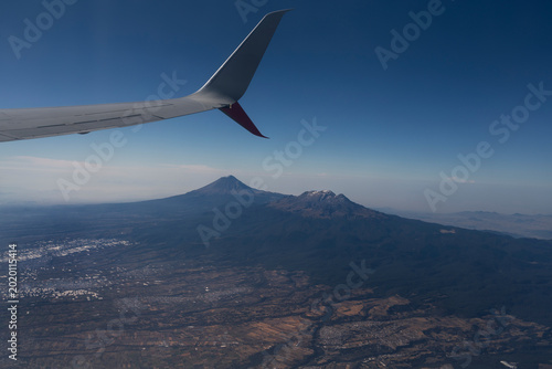 View from airplane window of the volcano Popocatépetl close to Mexico City airport