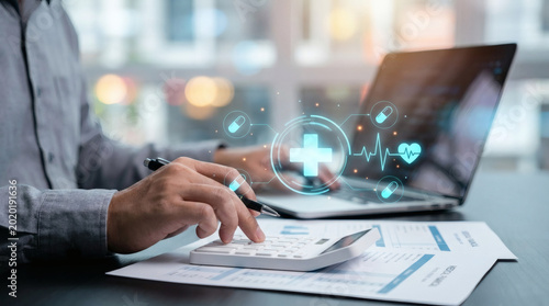 Healthcare professional analyzing medical costs and finance with calculator and laptop planning budget and insurance