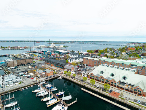 Cuadro en lienzo Newport harbor and marina panorama, a high-angle drone shot looking over luxury yachts, waterfront hotels, and downtown docks toward the distant Claiborne Pell Newport Bridge in Newport, Rhode Island