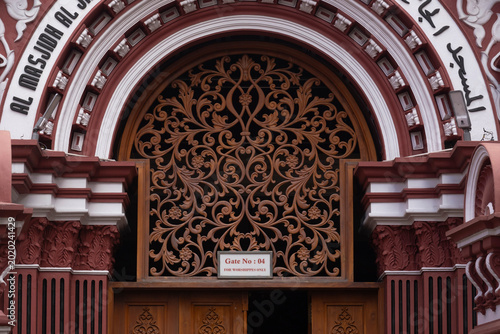 Intricate wood carving on Gate 4 of the Red Mosque in Colombo, Sri Lanka. Architectural detail of Jami Ul-Alfar.