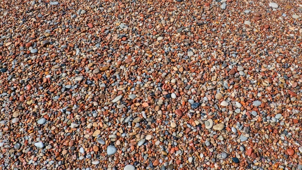 Foto Colorful sea pebbles texture background on a beach
