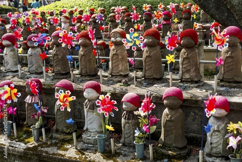 Jizo statues with red caps, protective deities for deceased children, Zōjōji Temple, Buddhist temple complex, Tokyo, Japan