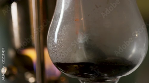 Victorian siphon coffee maker brewing coffee