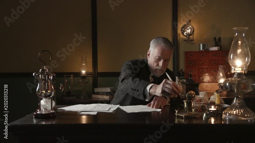19th century businessman writing with a dip pen