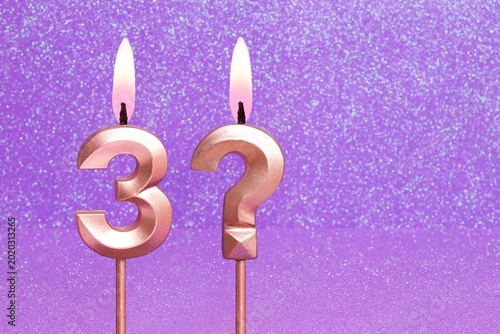 Number 3 and question mark on a pink background with blurred bright dots - Birthday or anniversary card with abstract blurred dots that glow