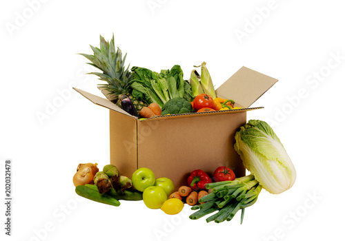 Open cardboard box with fresh vegetables and fruits, grocery delivery concept isolated on transparent background PNG