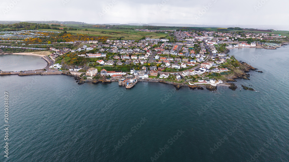 Αυτοκόλλητο Coastal headland protruding into the sea. Fife, Scotland.