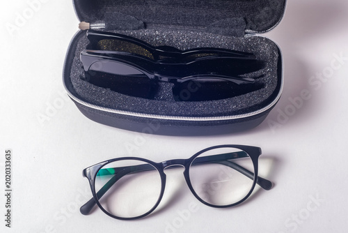 Vászonkép Prescription Glasses With Magnetic Polarized Lens Covers Displayed Beside Portab