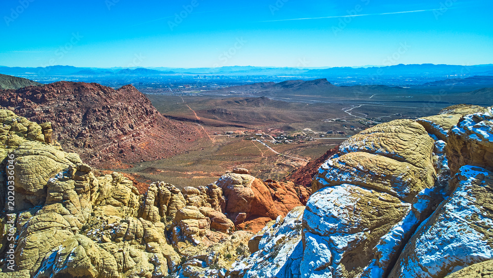 Εκτύπωση καμβά Aerial Red Rock Canyon Calico Tanks With Snow and Distant Las Vegas Skyline
