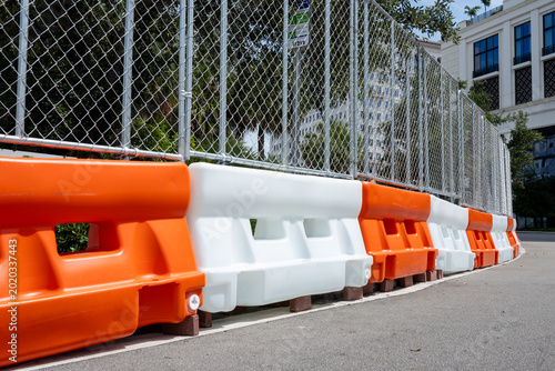 Obraz na plátne Road Construction Barriers and Chain Link Fence on Sunny Day