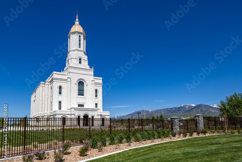 Smithfield Utah Temple Exterior LDS Church with Mountains Blue Sky and Landscaped Gardens