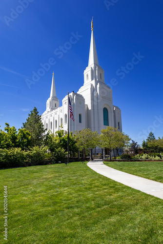 Brigham City Utah Temple Exterior with Mountains Blue Sky and Green Landscape Scenic View
