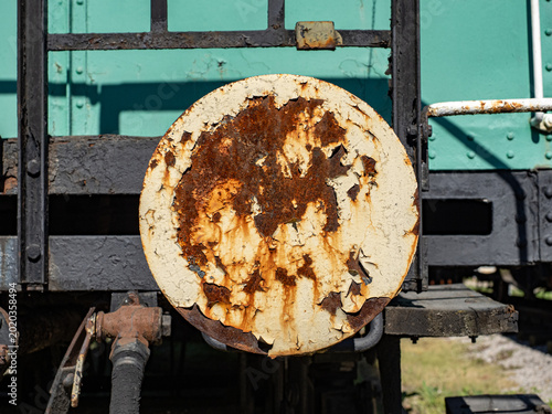 Rusty Peeling Paint On Vintage Railcar Metal Disk With Corrosion And Weathered Texture