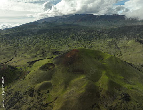 Bild auf Leinwand Aerial view of volcanic craters near Moana Kea, the tallest mountain in the worl