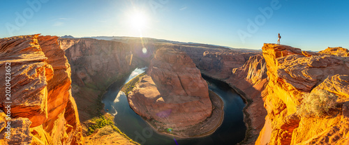 Obraz na plátně Woman enjoying panoramic view of horseshoe bend canyon during sunset