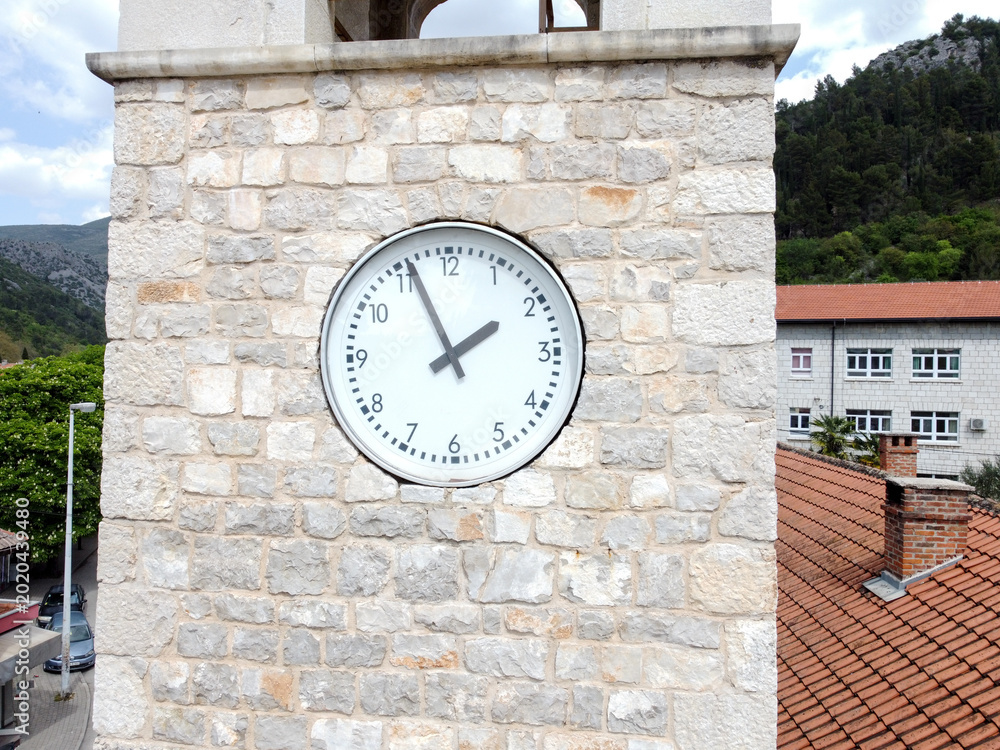 Foto Historic clock tower. Stone clock tower.