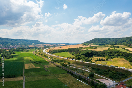 Canvas Print Aerial view of the A38 motorway near Bleicherode with surrounding infrastructure