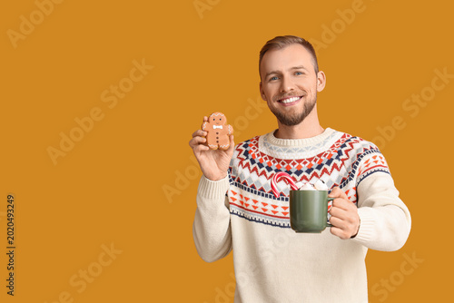 Young man in sweater with c...