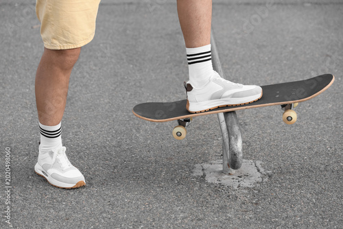 Legs of senior man with ska...