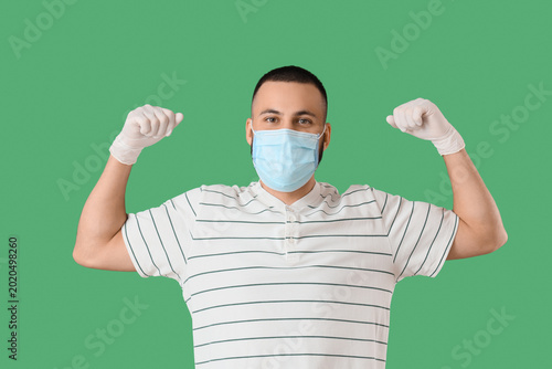 Young man in medical mask s...