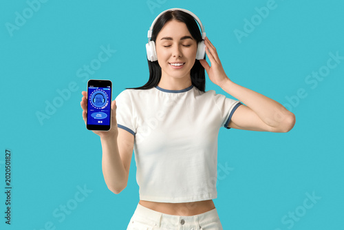 Young woman in headphones w...