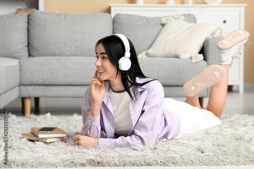 Young woman in headphones l...