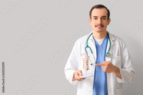 Male doctor pointing at spi...
