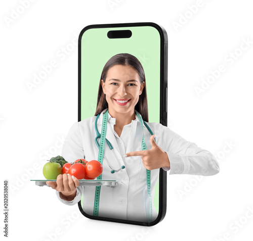 Female nutritionist pointin...