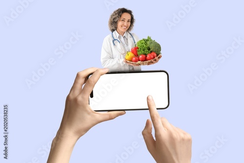 Hands holding mobile phone ...