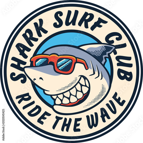 Round Shark Surf Club badge with smiling shark mascot wearing red sunglasses, bold ride the wave lettering, and vintage beach emblem style