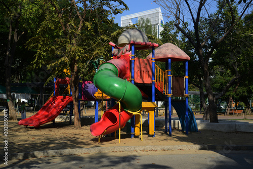 Climbing structures and slides are playground equipment for children, which are part of the Lumpini public park in Bangkok capital city , Thailand.