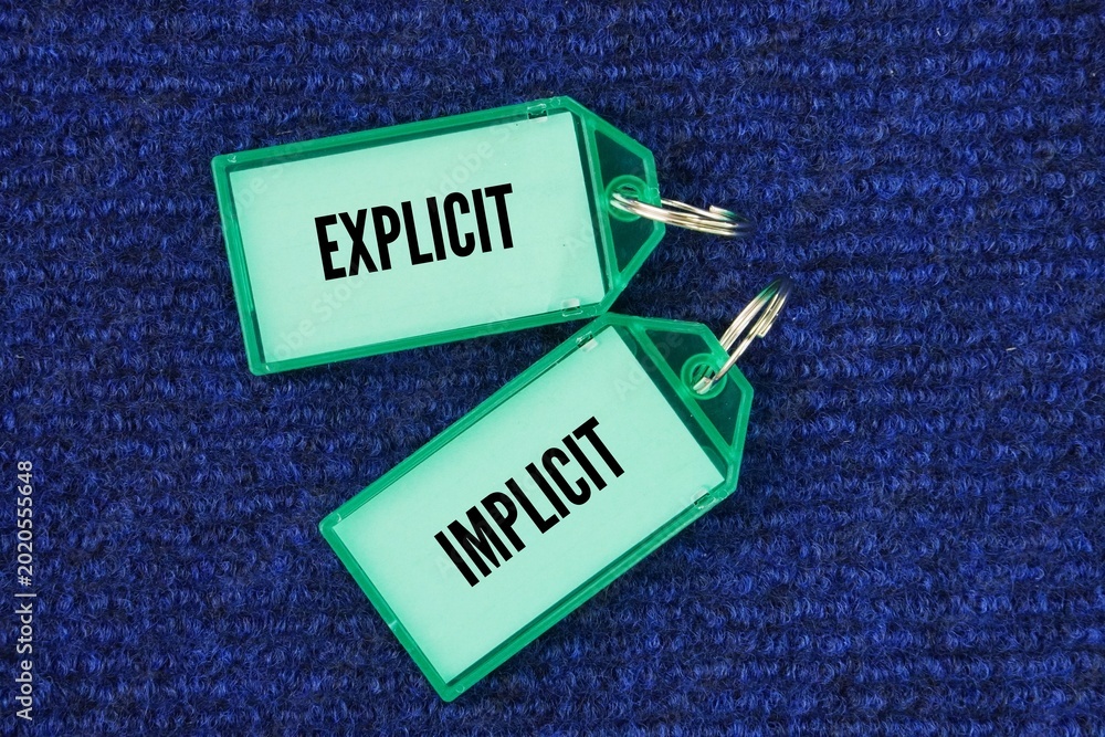 Foto Plastic tag with the words explicit and implicit